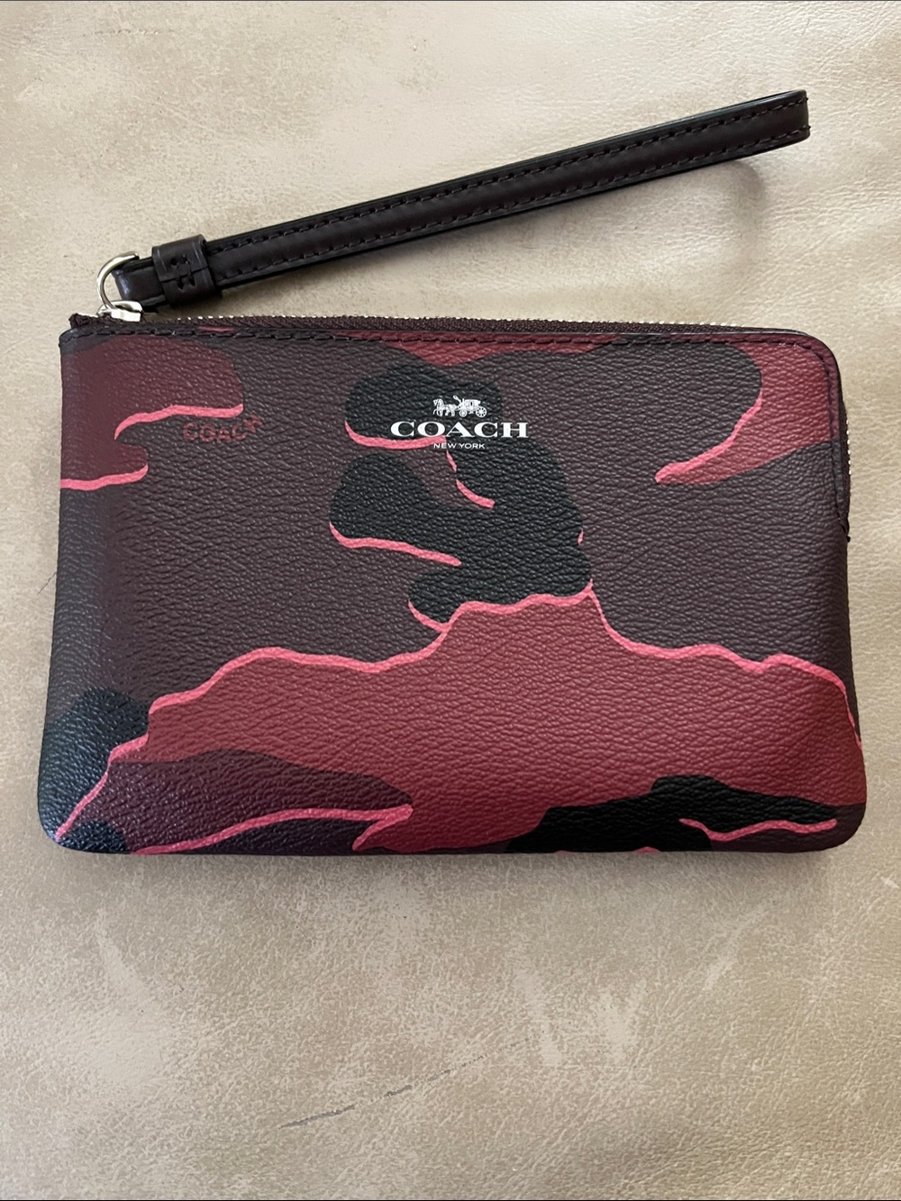 COACH women’s Burgundy and Black Camouflage Zip Wristlet